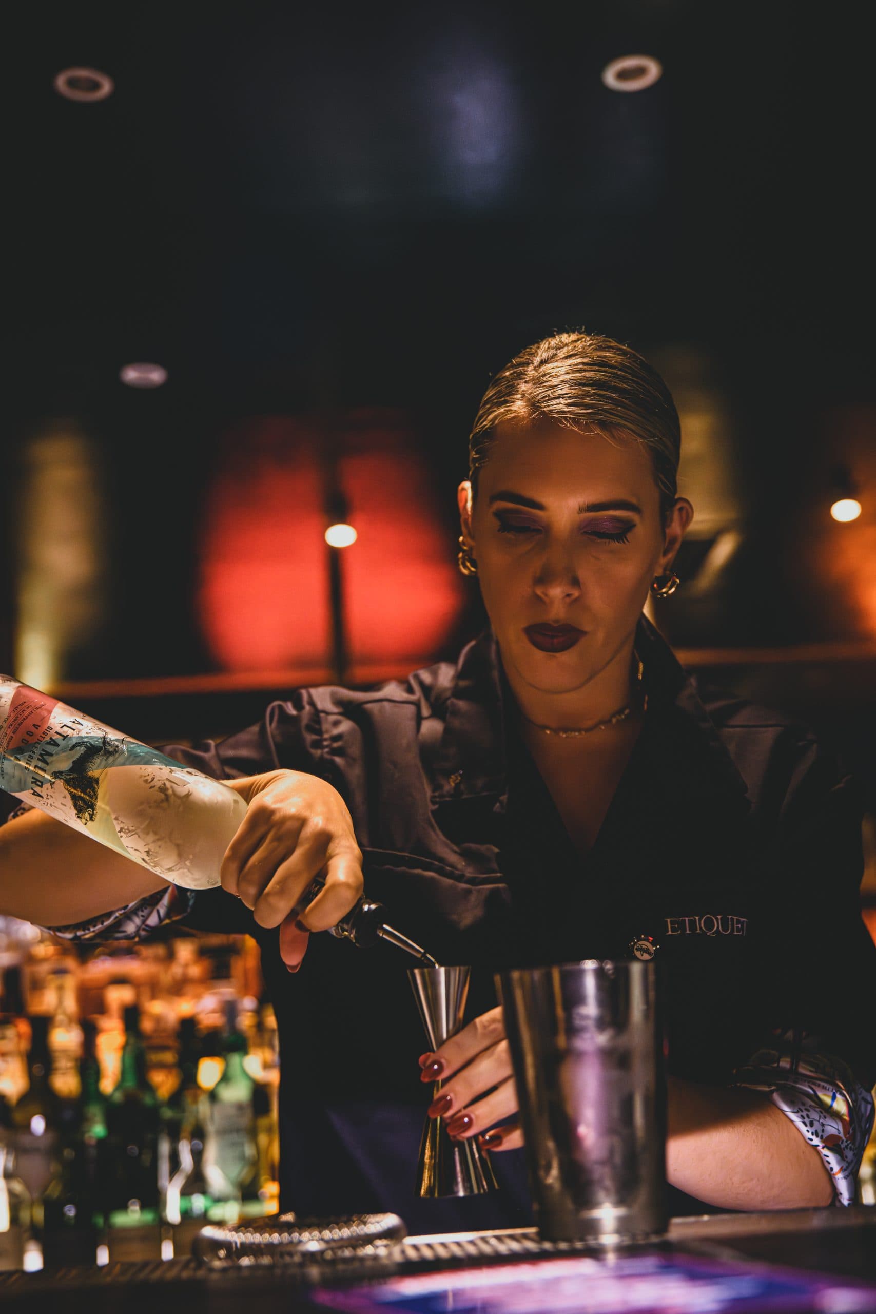A bartender preparing a cocktail during a guest shift